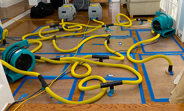 Professional Flood Damage Restoration technician working in Canterbury, NH